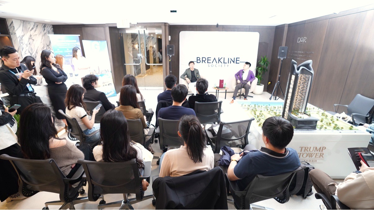 Audience viewed from behind watching two speakers in conversation on stage in front of the BREAKLINE backdrop at the Stablecoin & Web3 Founders Forum