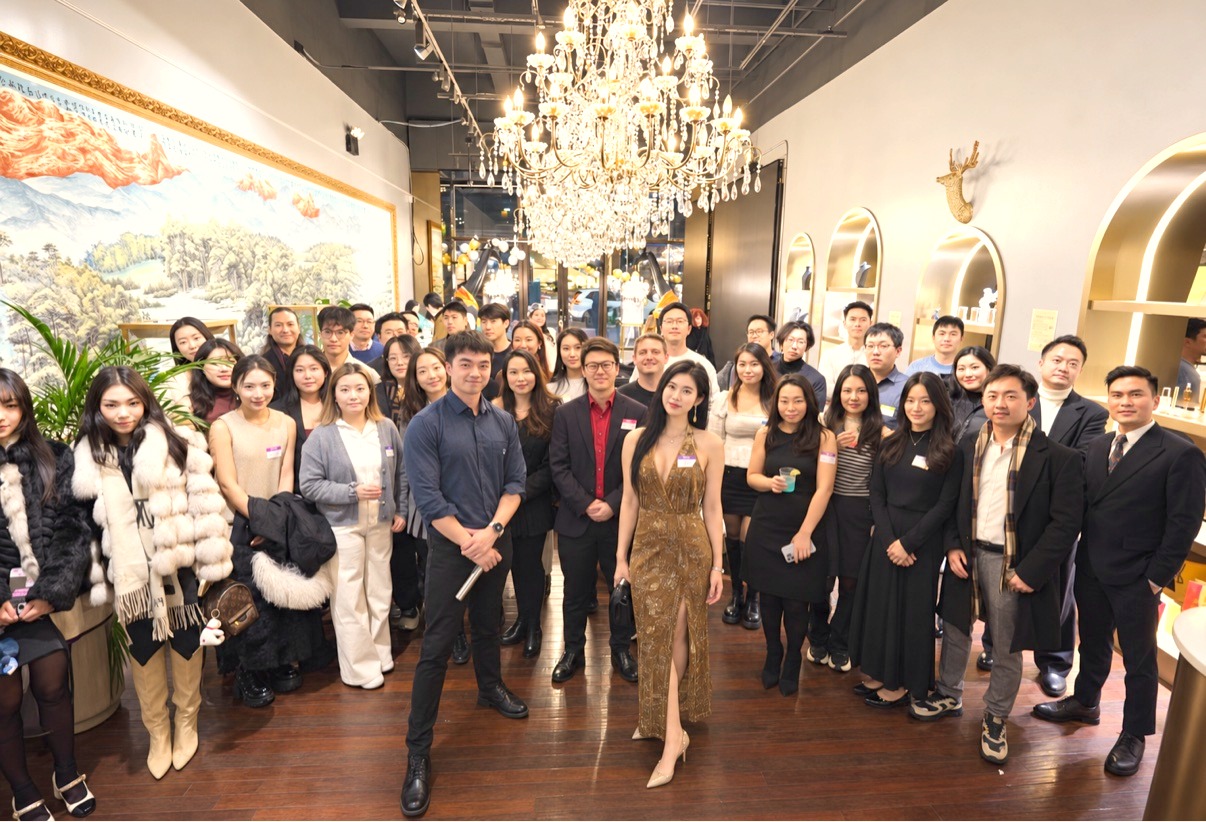 Breakline Society members gathered for a group photo at the Founder Meetup & Pitch Session, with founder Lucia Liu in a gold gown at the center front